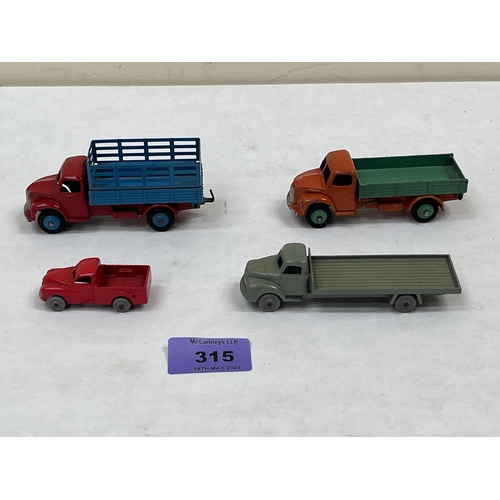 315 - Dinky Toys. Four mint commercial vehicles. Unboxed