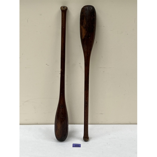 333 - A pair of treen juggling clubs. 24' long