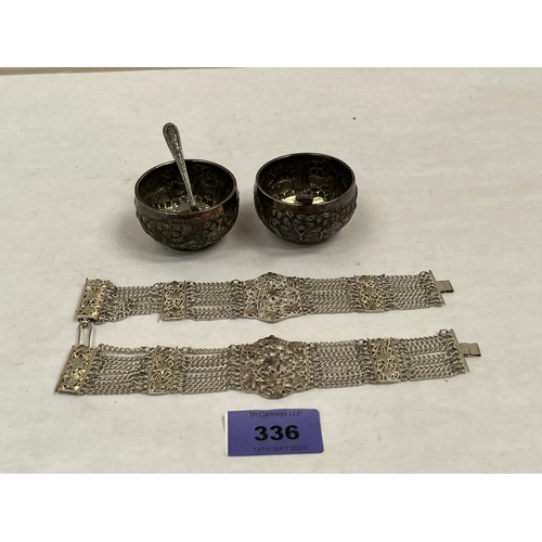 336 - A pair of Indian silver salts with spoons and a pair of Indian filigree bracelets