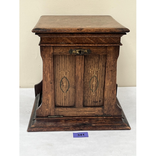 341 - An early 20th century oak smoker's cabinet. 10' high. Locked, key lacking