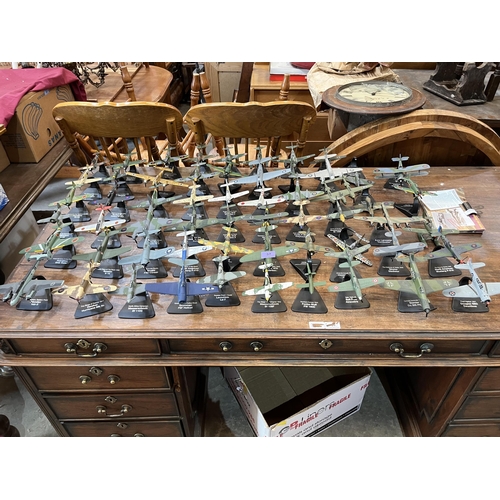 57 - A collection of 59 diecast model aeroplanes