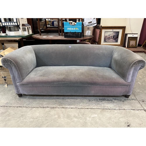 572 - A Victorian Chesterfield sofa on turned forelegs. 74' wide