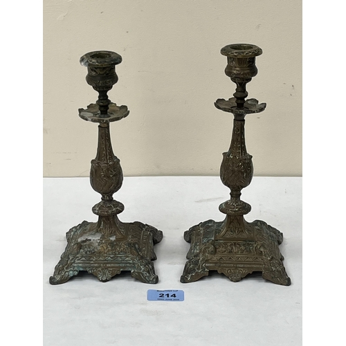 214 - A pair of 19th century French gilt metal candlesticks. 9¼' high