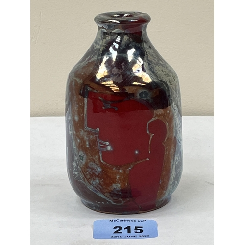 215 - A studio lustre flambe decorated vase, painted with a cubist style head in profile. Indistinctly sig... 