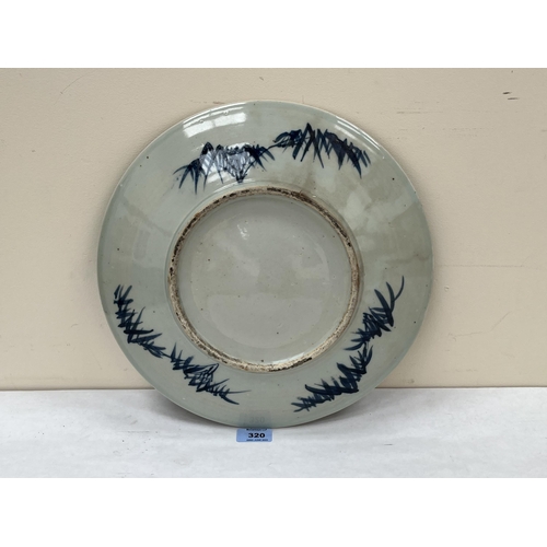 320 - A Chinese charger painted with birds and foliage within a reserved diaper border. 13¾' diam