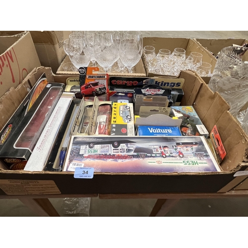 34 - A box of diecast model vehicles and a box of sundries