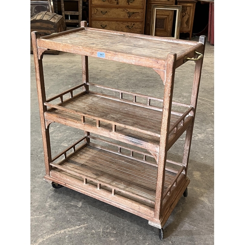 367 - An early 20th century teak triple stage serving trolley. 20'w x 36'h