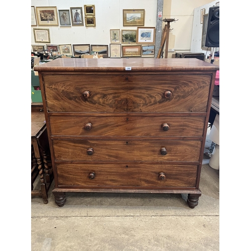 368 - A Victorian mahogany chest of four long drawers on turned feet. 48'w x 47'h. Splits to sides