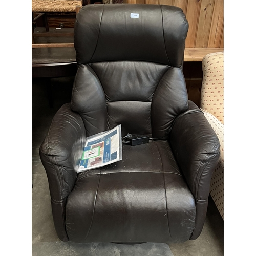 379 - An electrically reclining leather upholstered armchair