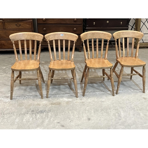 386 - A set of four beechwood lath-back kitchen chairs