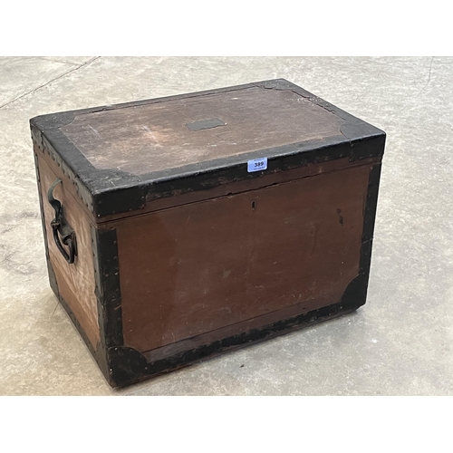 389 - A 19th century oak and metal bound chest, the interior compartmented for drinking glasses, cutlery e... 