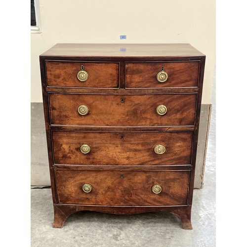 391 - A George III mahogany bowfronted chest, the crossbanded top over two short and three long cockbeaded... 