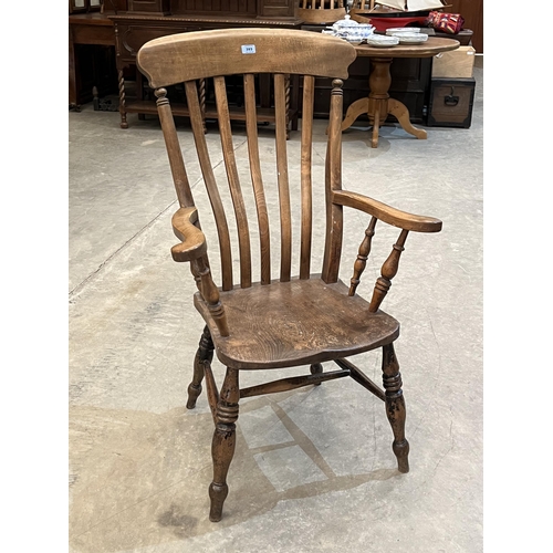 393 - A Victorian beechwood lath-back armchair with elm seat