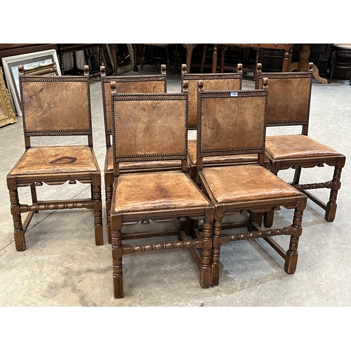 398 - A set of six 1930s 17th century style oak dining chairs with leather backs and seats
