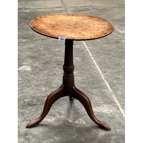 400 - A 19th century oak tripod table of fine colour, the one piece top on turned support. 20¼' diam