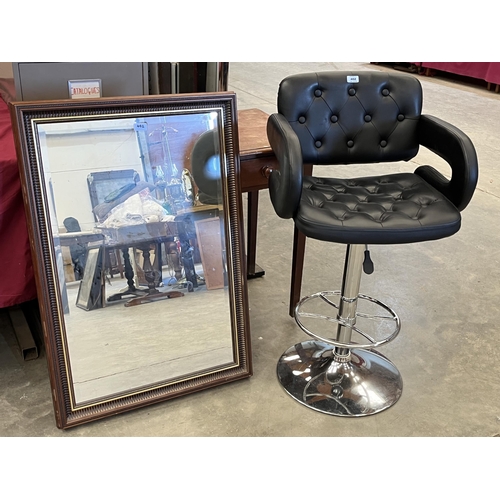 402 - A bar stool and a wall mirror with bevelled plate