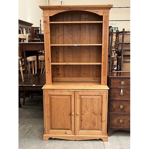 403 - A pine bookcase, the upper part with three adjustable shelves. 39'w x 80'h