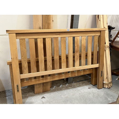 414 - A 5' light oak bedstead