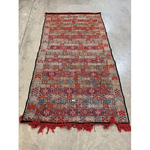 415 - A Moroccan Kilim carpet. 92' x 48'