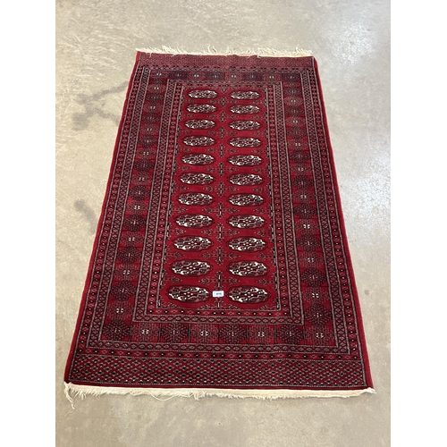 416 - A red ground Bokhara rug