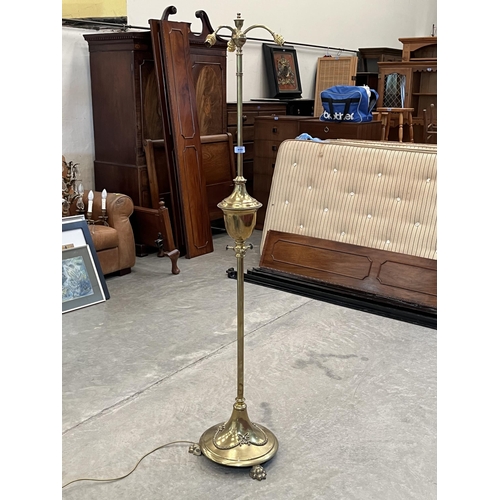 419 - An early 20th century brass telescopic three light lamp standard