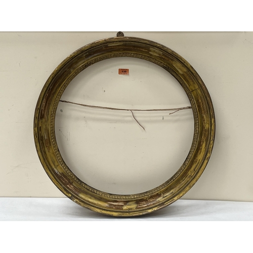 135 - A 19th century decorated parcel gilt convex mirror frame. 25½' diam