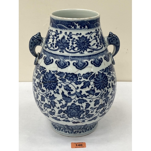 140 - A Chinese blue and white decorated two handled baluster vase. 12½' high. Extensive cracks.