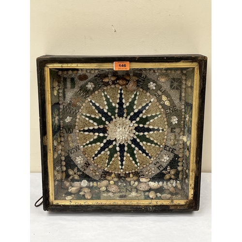 146 - A 19th century cased sailors shellwork in the form of a compass. 16' x 16'. Some shells detached