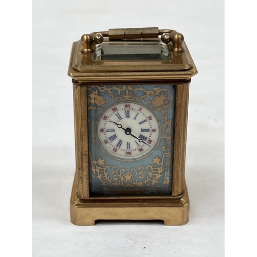 170 - A late 19th century French gilt brass miniature carriage timepiece, the dial sides and back with gil... 