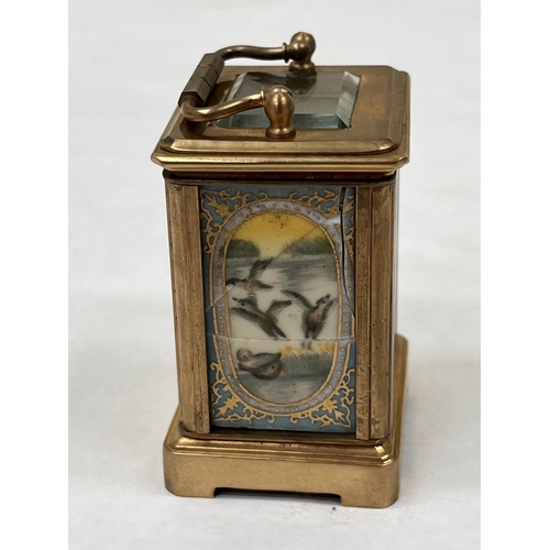 170 - A late 19th century French gilt brass miniature carriage timepiece, the dial sides and back with gil... 