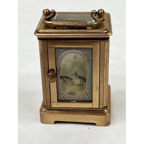 170 - A late 19th century French gilt brass miniature carriage timepiece, the dial sides and back with gil... 