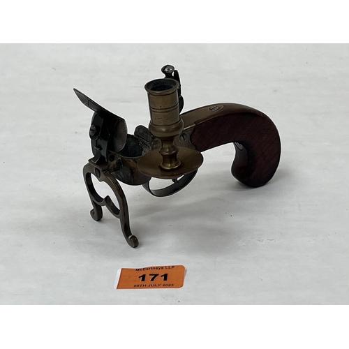 171 - A 20th century flintlock table lighter with walnut stock. 5¼' long.