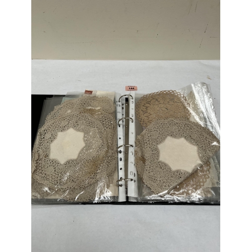 144 - A collection of lace textiles, Victorian greetings cards etc.