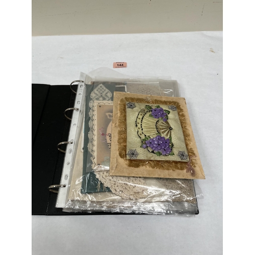 144 - A collection of lace textiles, Victorian greetings cards etc.