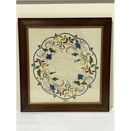 337 - A 1930s oak framed needlework banner. 19