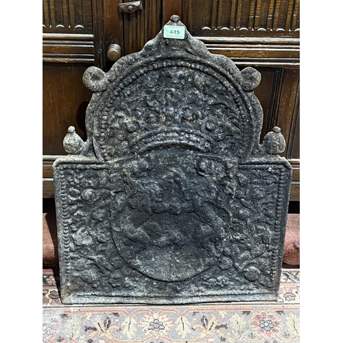 445 - A 19th century cast iron fire back. 24