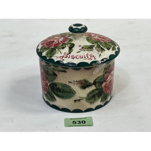 530 - A Wemyss biscuit jar and cover, retailed by T. Goode, London. 4¼