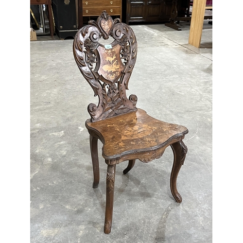 567 - A 19th century walnut marquetry musical chair with shaped foliate carved back. Probably Italian.