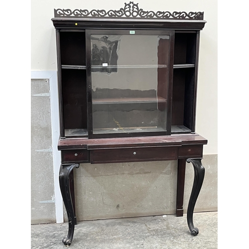 569 - A 19th century rosewood bookcase on stand. 48