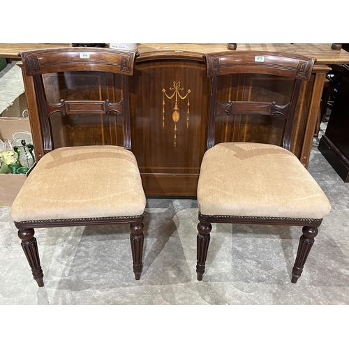 578 - A pair of 19th century mahogany tablet back dining chairs and an inlaid mahogany headboard.