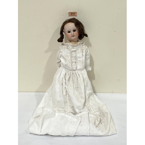 211 - An early 20th century German doll, the bisque head with brunette wig (A.F), sleeping eyes and open m... 