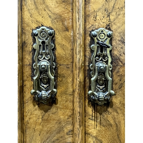 351 - A fine quality Victorian burr oak secretaire bookcase, the upper part with three tooled leather and ... 