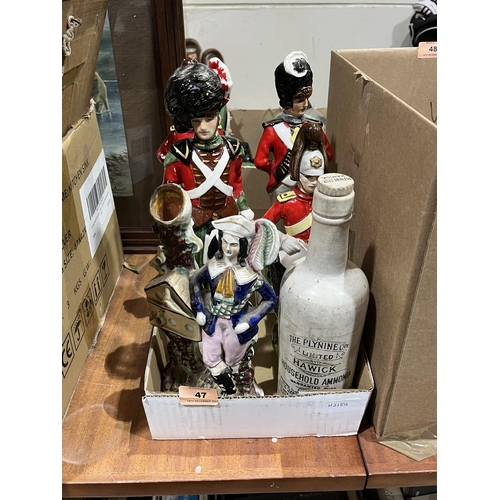 47 - Four ceramic decanters modelled as soldiers, a Staffordshire spill vase and an ammonia bottle.