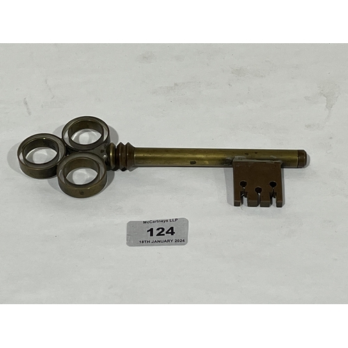 124 - A brass corkscrew in the form of a door key. 7½