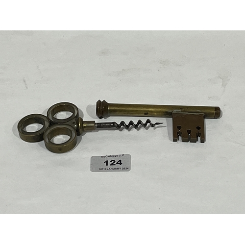 124 - A brass corkscrew in the form of a door key. 7½