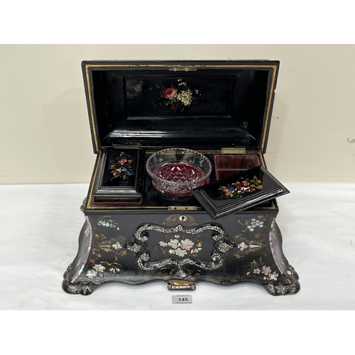 145 - An early Victorian papier-mache and mother-of-pearl inlaid tea caddy in the manner of Jennens and Be... 