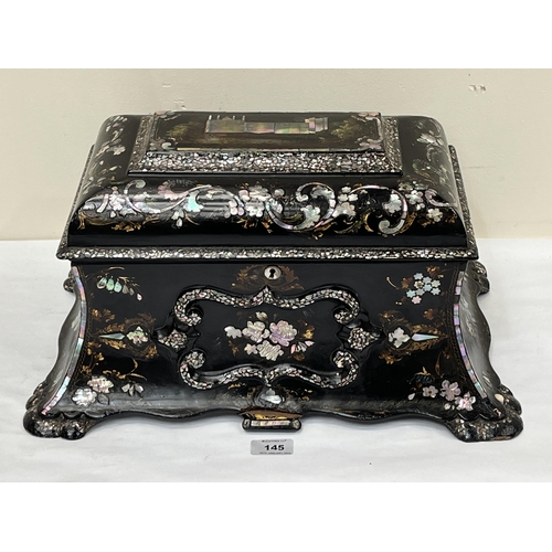 145 - An early Victorian papier-mache and mother-of-pearl inlaid tea caddy in the manner of Jennens and Be... 