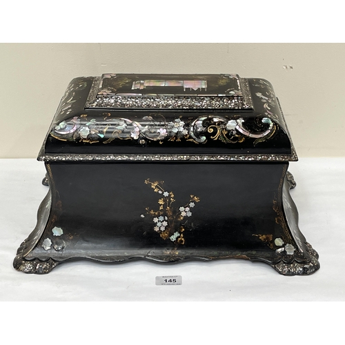 145 - An early Victorian papier-mache and mother-of-pearl inlaid tea caddy in the manner of Jennens and Be... 