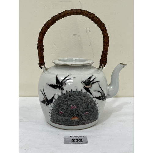 232 - A Chinese porcelain teapot and cover, decorated with foliage and flying insects to one side and swal... 