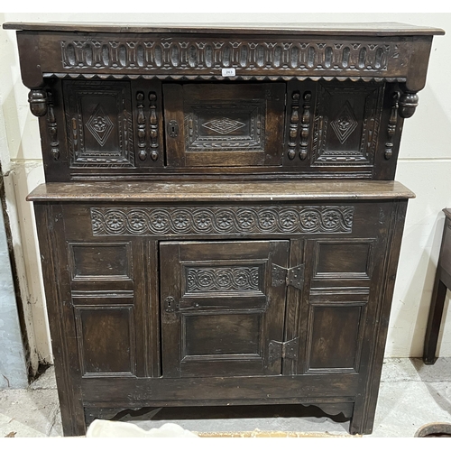 263 - A Charles II joined oak press cupboard, with lozenge carved and fielded panels, the upper part with ... 